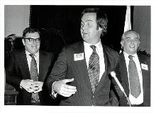 Board member Michael Flaherty speaks while Jim Molloy (left) looks on.