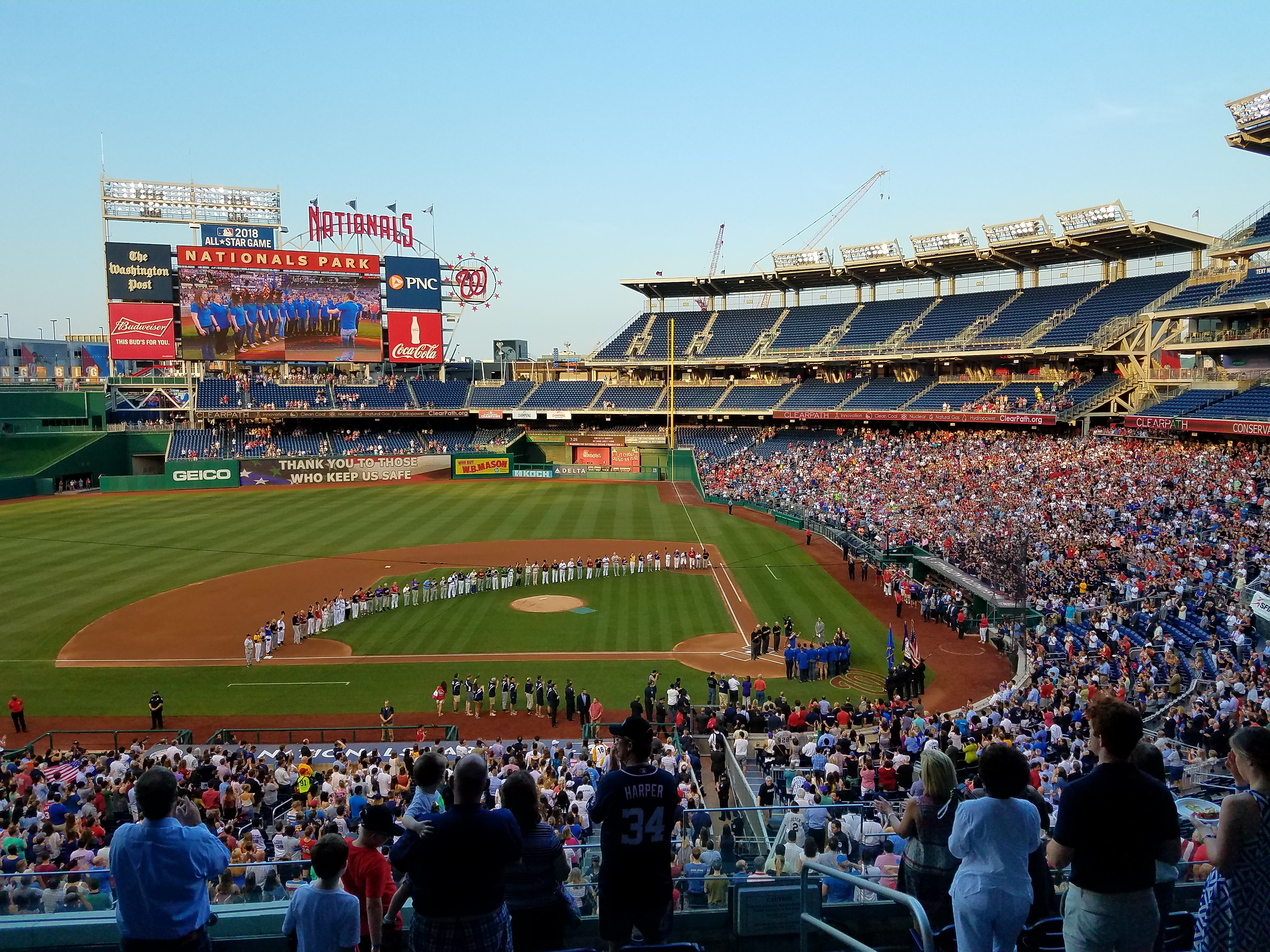 Players lined up from 1st base to 3rd base