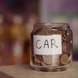 Jar labeled Car with coins in it