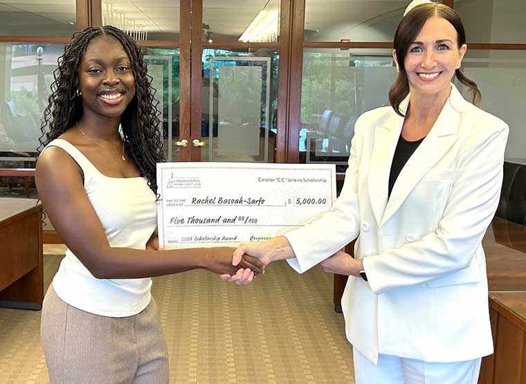 Rachel Basoah Sarfo with $5,000 check